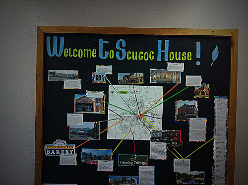 Bulletin Board Featuring A Map With Local Eateries And Landmarks.webp
