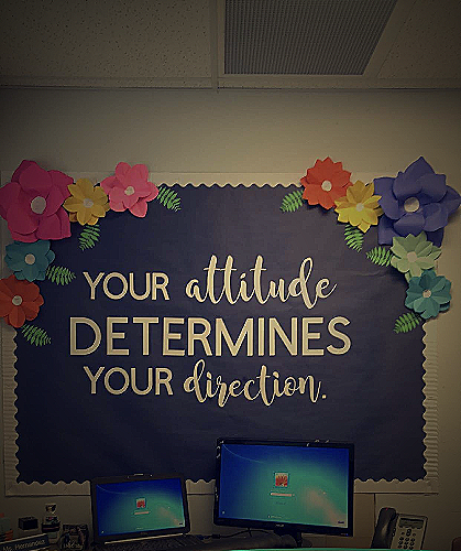 Image of a bulletin board featuring inspirational quotes and stories